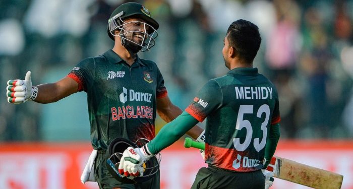 Bangladesh's Mehidy Hasan Miraz (R) celebrates with Najmul Hossain Shanto after scoring a century (100 runs) during the Asia Cup 2023 one-day international (ODI) cricket match between Bangladesh and Afghanistan at the Gaddafi Stadium in Lahore on September 3, 2023. (Photo by Asif HASSAN / AFP)